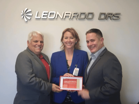 Wendy Romeu accepts an award as Leonardo DRS Supplier of the Year